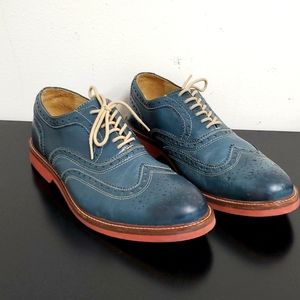 Navy blue (not super dark) 1901 shoes w tan laces and tan stitching.